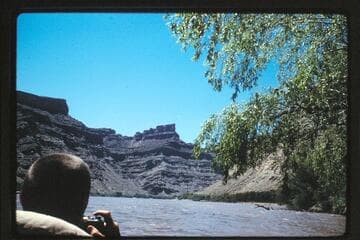 Plane rising out of canyon at junction