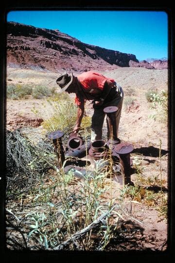 Old sluicing head stone, Cass Hite's, Ticaboo bank (note gravel bank in rear), "Doc" Marston