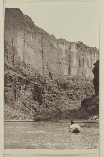 Jackie Frost in 10-ft. Wilson Fold-flat boat used on San Juan River in 1938, Aug.-Sep. trip.  Mile 4 1/2-5.  At point opposite talus in Atherton photo of 1961, Sep. 30.  "Lower can--perhaps Mile 2-4 (from formation only)."  PTR 8-28-58 [Reilly]