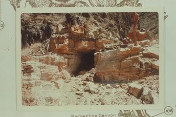 Horizontal shaft about 25 feet deep at Bass Asbestos Mine in Hakatai Canyon.  Note hand tools at left