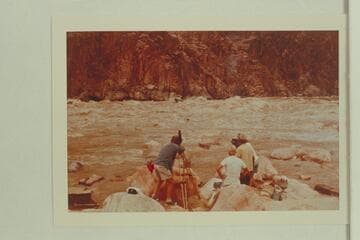 Cameras trained on one of the aluminum boats; Monument Creek Rapid