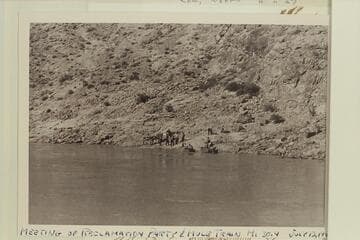 The Bureau of Reclamation outboard boats are met by the trail party at 29 Mile Canyon Trail
