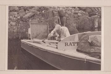 Joe Desloge works at the details of packing (pouring gas); Tapeats Creek