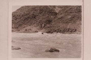 Cooper running the "Sweet Chariot" through Dubendorff Rapid.  The flow approximates 30,000 cfs