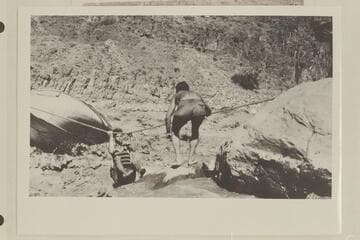 Bill Adger comes ashore from efforts to salvage the "Powell" locked in the rocks of Dubendorff Rapid