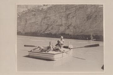 Nevills at the oars of the "WEN" at the foot of Horseshoe Canyon.  Joan Nevills and Ros Johnson are on the stern and Al Milotte sits foreword.  Note the "windmill recovery" of the oars used by Nevills