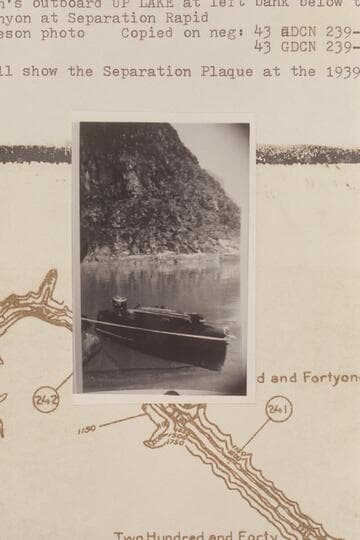 Harry Aleson's outboard "Up Lake" at left bank below the mouth the side canyon at Separation Rapid.  A glass will show the Separation Plaque at the 1939 location