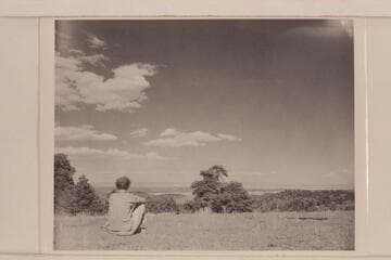 Margaret Marston looks into the lower Grand Canyon country from the top of Mt. Logan