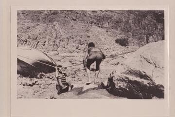 Bill Adger comes ashore from efforts to salvage the "Powell" which became locked in the rocks of Dubendorff Rapid on 1927, July 27.  The operation was abandoned July 31