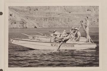 The Clover-Nevills party lined up for photographers on Lake Mead after completing Grand Canyon traverse of 1938.  Emery Kolb stands on the deck of the "Wen."