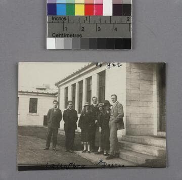 Edwin Powell Hubble and Grace Burke Hubble, standing outside a stone building with five (5) other people, in Wellesley, Mass