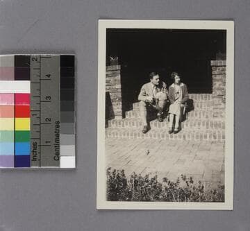 Edwin Powell Hubble and Grace Burke Hubble on their wedding day, February 26, 1924, seated on brick steps at the Burke family home