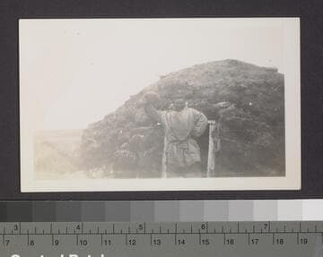 Native man and dwelling