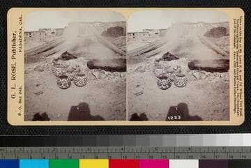 Burning pottery, Acoma Pueblo