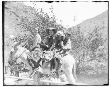 The children of Mill Creek's flume tender enjoy a ride on a gentle donkey near Mill Creek #3 Hydro Plant
