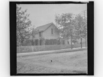 Unidentified two-story house on street