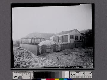 Child in front of Malibu Movie Colony home