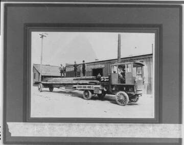 Southern Sierras Power Company's big Alco truck hauling a load of poles out to Elsinore, 1913