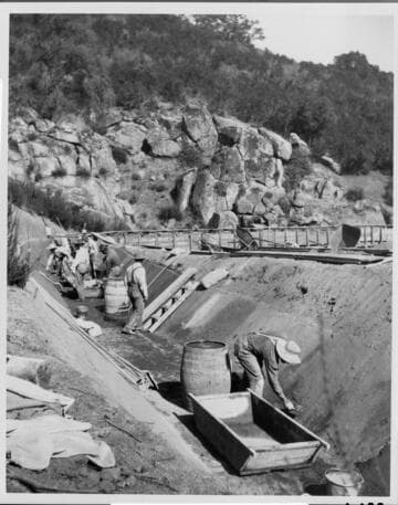 A repair crew repairing damage to the ditch carrying water to the Tule Hydro Plant, 1914