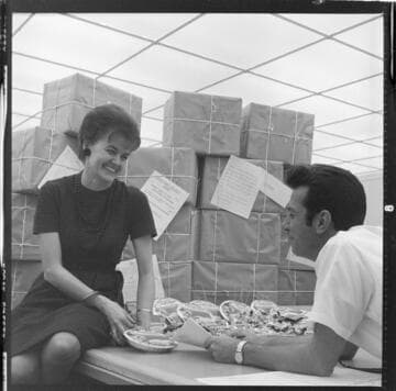 Edison employees working on Christmas project preparing gift boxes for servicemen in Vietnam & and dolls for needy children