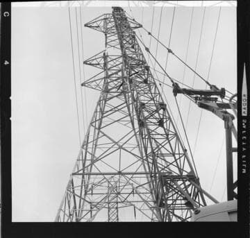 Constructing a tall 220kV double-circuit transmission tower with a crane