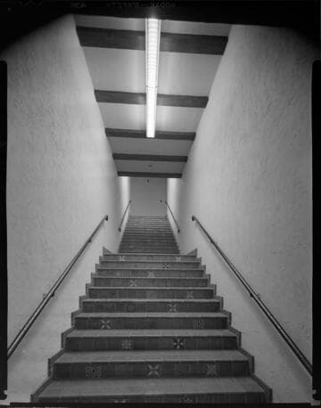 Fraternal organization with large open meeting room and chairs on the sides