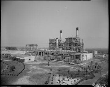 Wide profile shot of Etiwanda Generating Station with the control building on the left the station units on the right