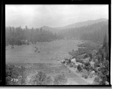 Open field with shed at edge