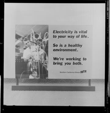 Display on Coastal Power Plants showing environmental protection measures for fish and one promoting electrical use