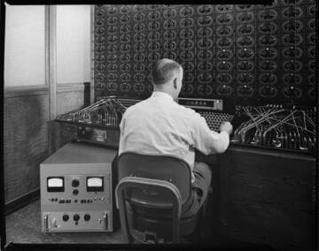 Switchboard console with man working