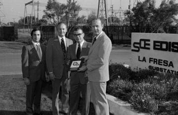 Award certificate presentation to men at La Fresa Substation