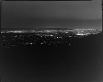 Cityscapes at night in Los Angeles County from the local mountains