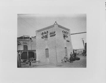 W. F. Holt standing next to the Holtville Substation, 1910