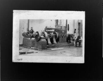 An operator standing by one of the original "Jumbo" dynamos installed at Thomas Edison's Pearl Street Plant in New York City,  1882