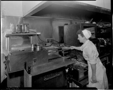 Lady cooking in commercial type kitchen