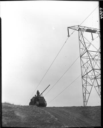 Moving power auger rig on truck to dig holes for pole placements