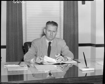 Man seated at desk