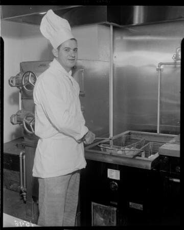Chef using electric deep fryer