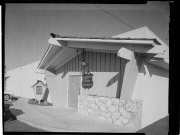 Chalet with sign "Banquet Room Entrance"