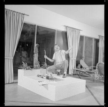 Man by an indoor water garden