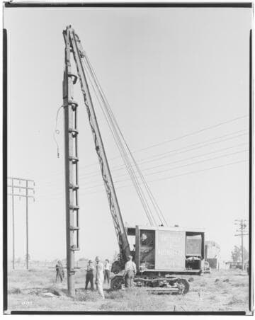 Barre-Lighthipe Transmission Line - Men placing pole with a Pile Driver