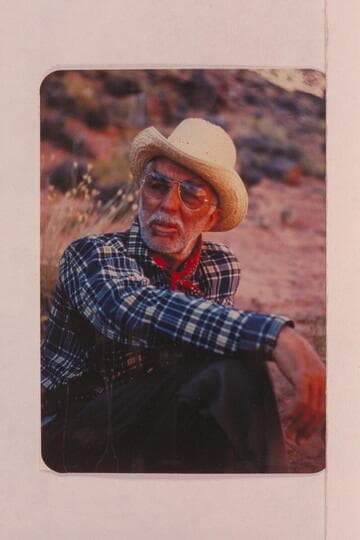 Arch-eyes Masland refuses to be convinced that he was cruel when he turned out the horses from his bed the night before.  Navajo Canyon