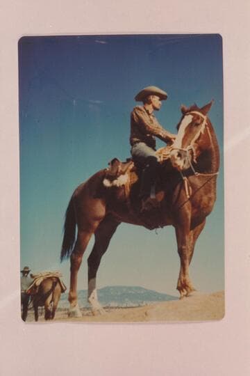 Tom Daly and Chillie Whitehat at left; Navajo Mountain in distance.  In edge of Navajo Canyon