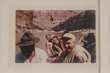 Crew of the Hatch-Dines party.  Walt Emery wears the campaign hat.  Bruce Dines wears no shirt.  Smuss Allen wears hat in center.  Smokey Patten in foreground.  Allan Smith in rear hidden by Jim Nelson.  Eight rode in the pontoon