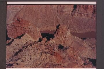 Approx. Mile 200 in Cataract Canyon.  Preliminary gauge:  29,700 cfs