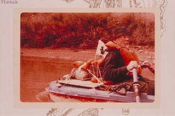 Dock Marston with Skunk Flag and in Sportyak; about Mile 164 above Hite