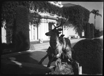 South terrace of the Huntington residence with bronze sculpture, "Stag Hunt."