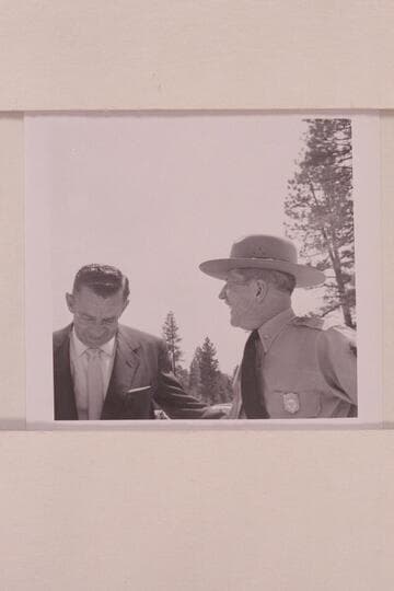 Louis Schellback (right) expresses pleasure at the opening of the Visitor's Center at the South Rim; Chuck Richey left