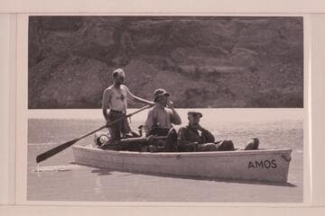 Frank Swain, Bill Chryst, Julius F. Stone in the "Amos" during traverse of Glen Canyon.  Boat named for Amos Burg