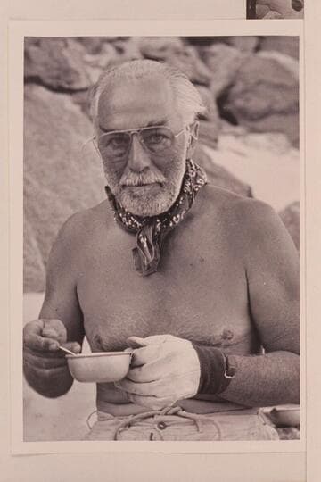 Frank E. Masland, "Fisheyes," takes care of a hot cup of coffee.  Grand Canyon traverse of 1954, June.  Diamond Creek